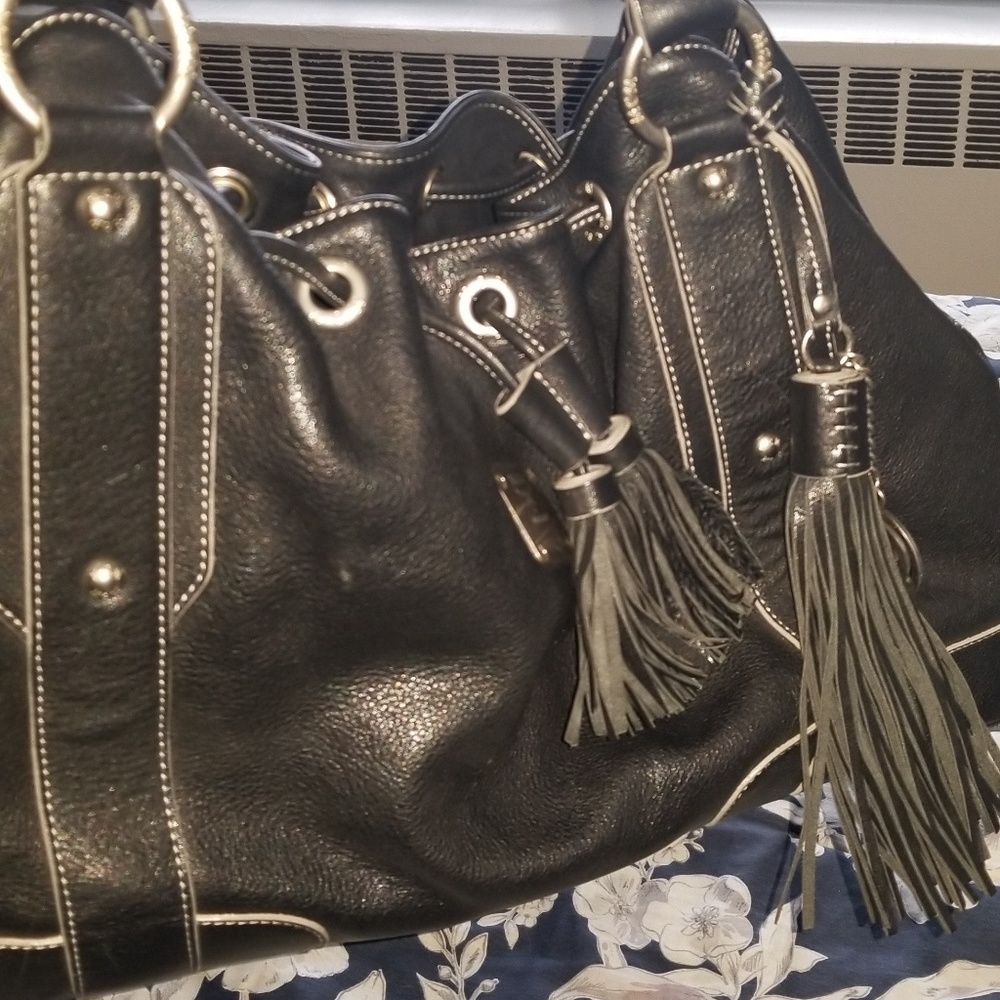 MCM authentic black leather bag with tassles EUC